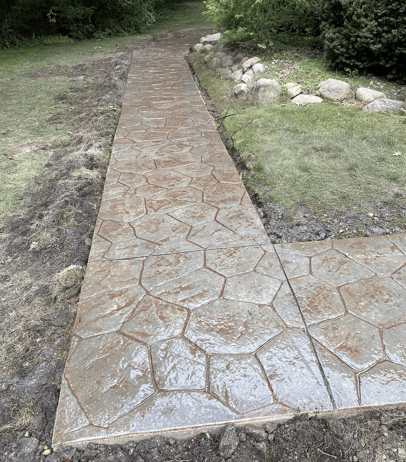 Why Milford Homes Benefit From a Custom Walkway